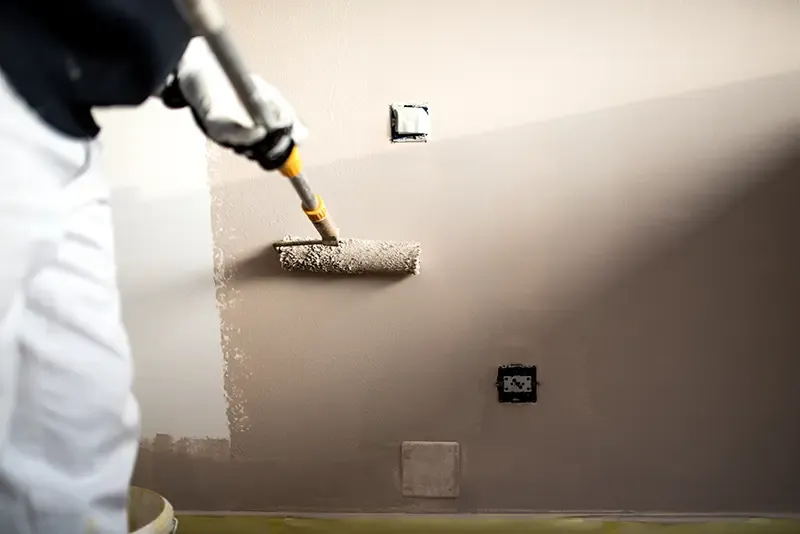 Roller painting of interior walls in an Ottawa home